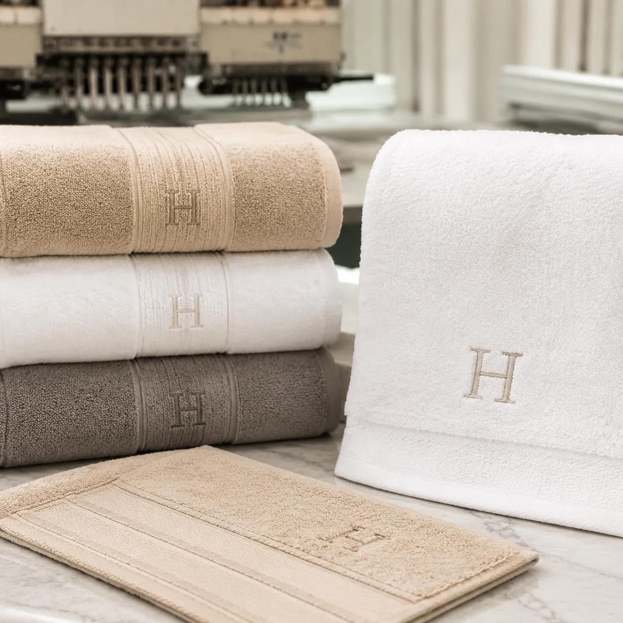 Monogrammed bath towels logo decoration guide showing embroidery placement on cotton bath towels